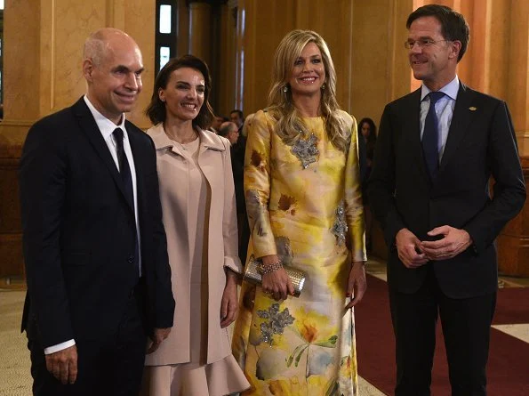 Queen Maxima wore Oscar De La Renta cold shoulder ruffled wool midi dress and Natan Embroidered yellow dress from Spring Summer 2018 collection