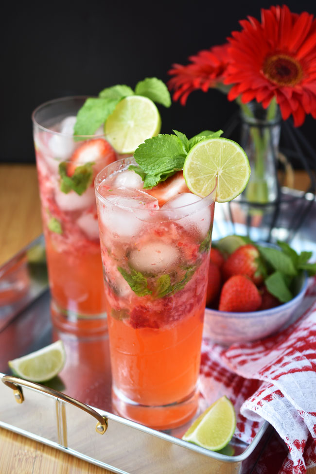 This family-friendly Strawberry No-jito is a great party drink for Canada Day or Fourth of July! Alcohol-free, full of natural ingredients & delish!