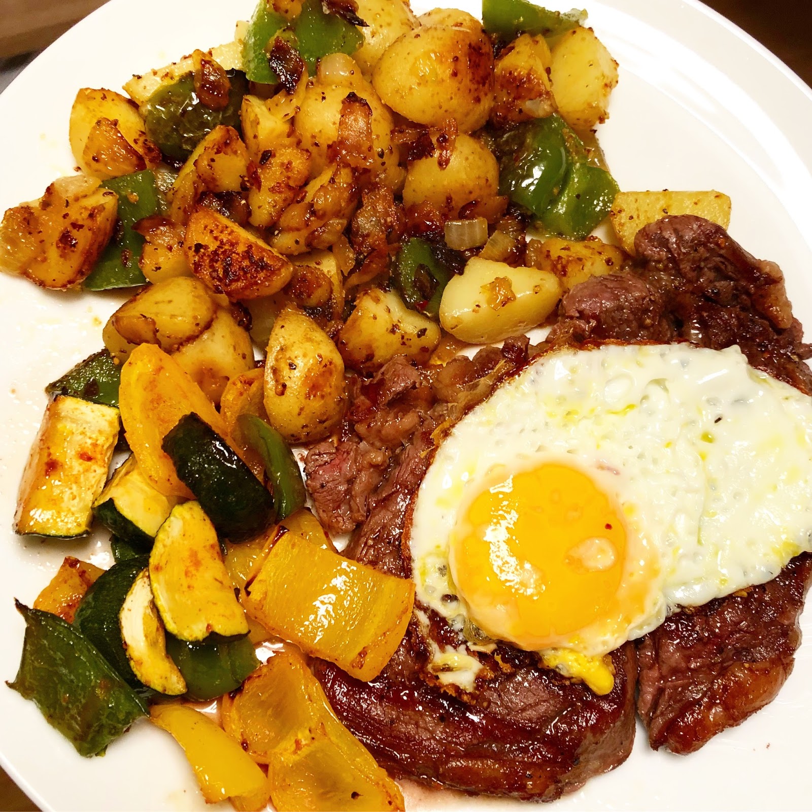 Grilled Steak with O'Brien Potatoes and Eggs
