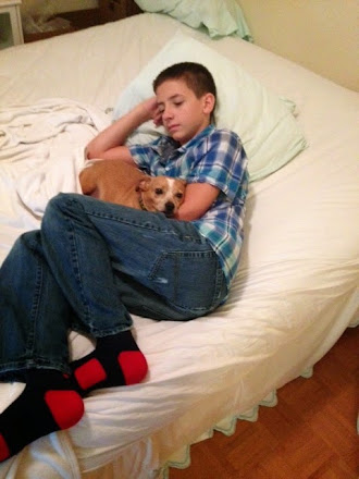 Boy and his dog...both tired.