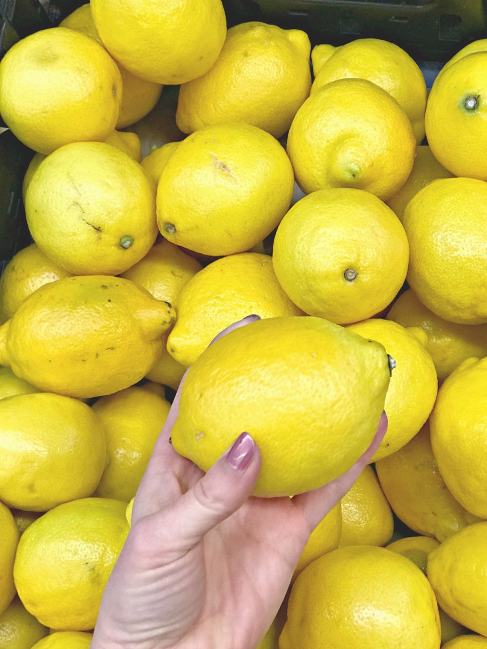 woman squeezing a lemon