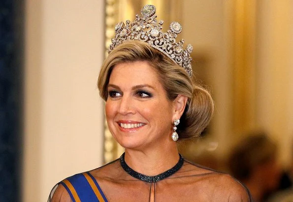 Kate Middleton's wearing the Lovers Knot Tiara, Diana's Collingwood earrings and blue McQueen gown. Maxima' Jan Taminiau gown and pearl tiara