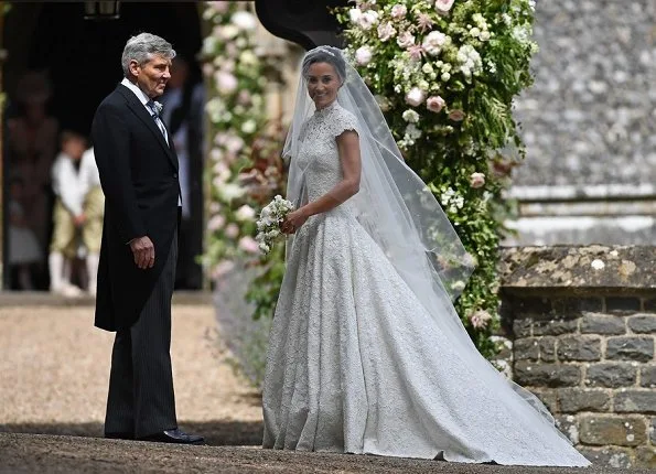 Duchess Catherine, her children Prince George of Cambridge, page boy and Princess Charlotte of Cambridge, flower girl attend the wedding of Pippa Middleton