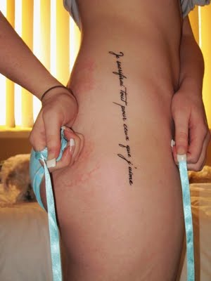 pictures of tattoos for women on side. letter tattoos for women.