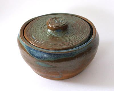 carved and glazed pottery covered pot