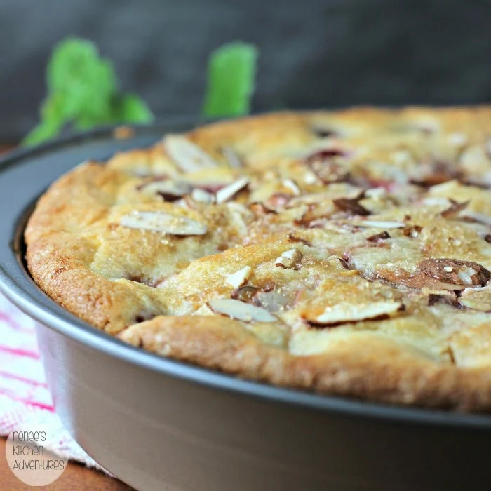 Cherry Delicious Almond Cake by Renee's Kitchen Adventures in the pan cooling 