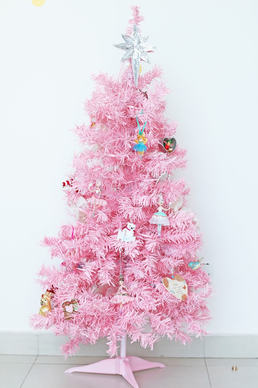 Use spray paint on a white tree to create this pink Christmas tree!