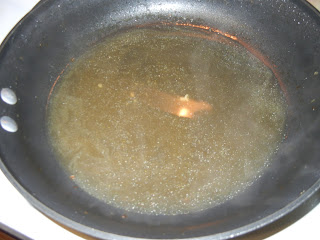 chicken broth and lemon juice in a frying pan 