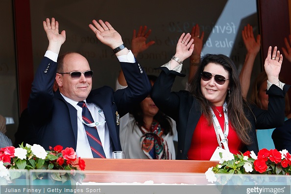 Albert II, Prince of Monaco and Melanie-Antoinette de Massy taking part in the mexican wave during day seven of the Monte Carlo Rolex Masters tennis at the Monte-Carlo Sporting Club 