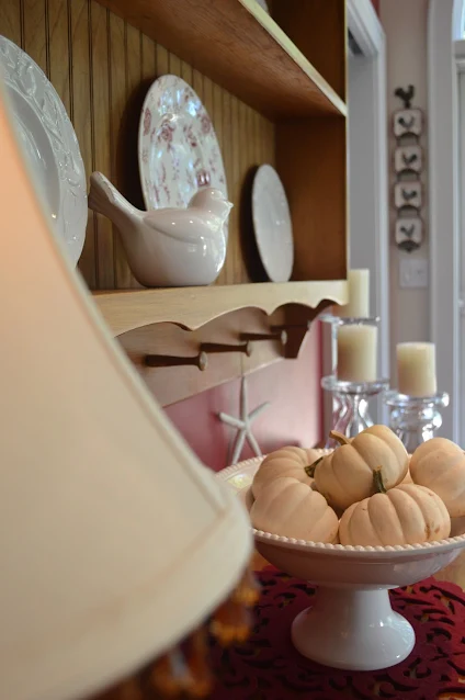 Baby Boo Pumpkins in a white pedestal bowl