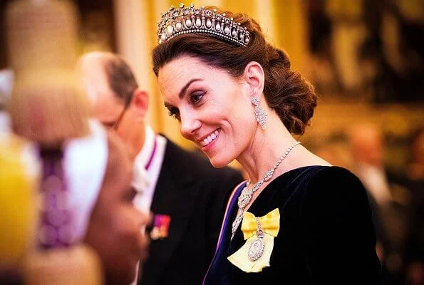 Kate Middleton wore a velvet Alexander McQueen gown, the Lover's Knot tiara, the Nizam of Hyderabad necklace