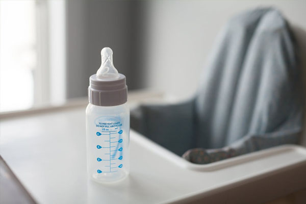 high chair with baby bottle