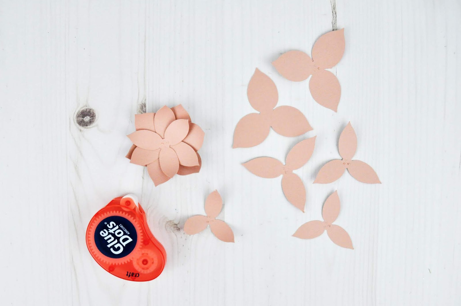 Christmas Gift Boxes with 3D Poinsettia Paper Flowers. Jen Gallacher uses boxes from JoAnn and die cut shapes from Silhouette to create this Christmas craft. #christmascraft #papercrafter #silhouette #jengallacher Christmas Gift Boxes with 3D Poinsettia Paper Flowers. Jen Gallacher uses boxes from JoAnn and die cut shapes from Silhouette to create this Christmas craft. #christmascraft #papercrafter #silhouette #jengallacher