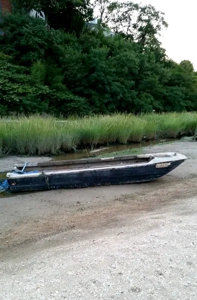 Old Boat In The Sand On A Beach