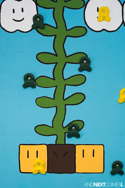 Close up of Super Mario themed DIY climbing wall for kids