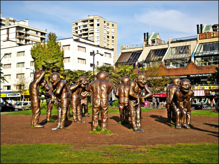 The Traveller Totem Poles and Laughing Statues at Vancouver British