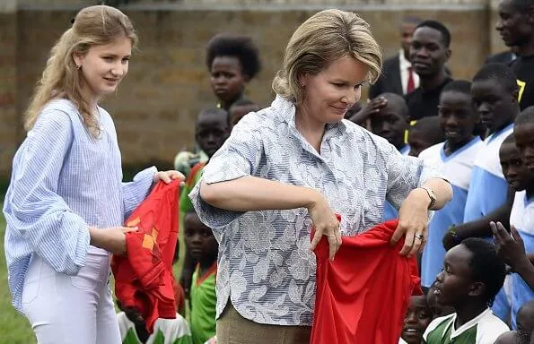 Queen Mathilde Dries Van Noten jacket and trousers, Natan dress, Crown Princess Elizabeth in Maje blouse and white trousers