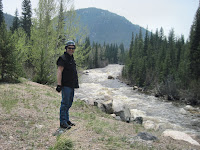 Tim beside raging Poudre River