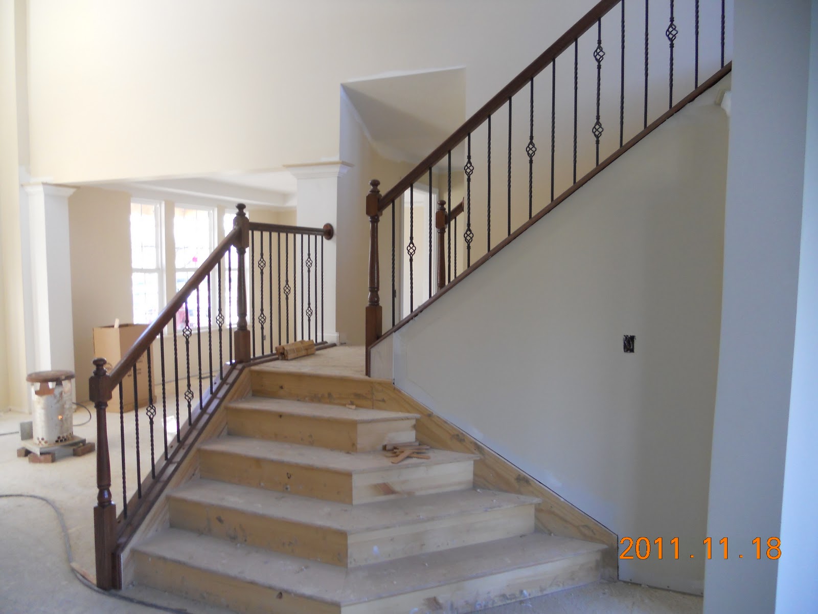 Brick work complete, stair railing installed and trim work in progress