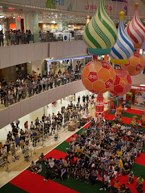 crowd watching soccer match at the apm shopping mall in Hong Kong
