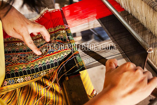 Weaving Lao textiles and fabrics on a loom