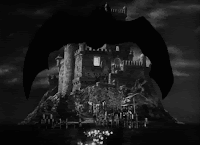 A bat flies towards a castle (in black and white)