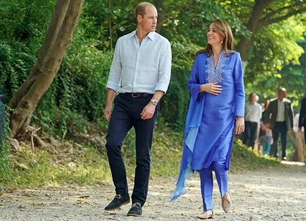 Kate Middleton wore a blue Kurta and trousers by Pakistani designer Maheen Khan and the Zeen earrings. Catherine Walker tunic