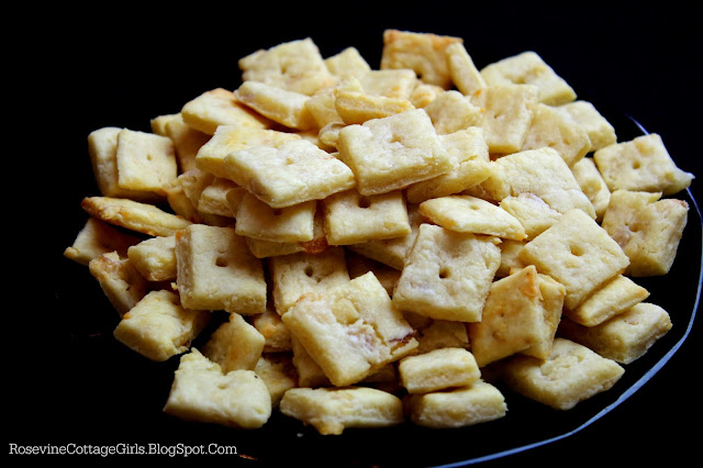 Transylvanian Cracker Recipe | black bowl filled with cheese crackers on a black background | rosevinecottagegirls.com