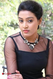 Actress Aswini Stills in Black Dress at Aavu Puli Madhyalo Prabhas Pelli Press Meet  0001