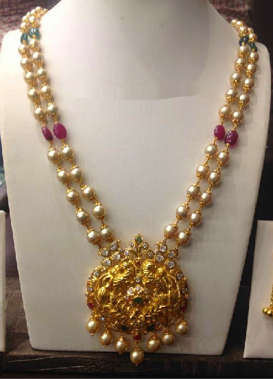 Jewellery Designs : #@ Pearl Ruby mala with Desinger locket