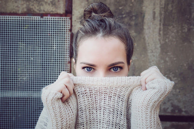 Woman hidding half her face