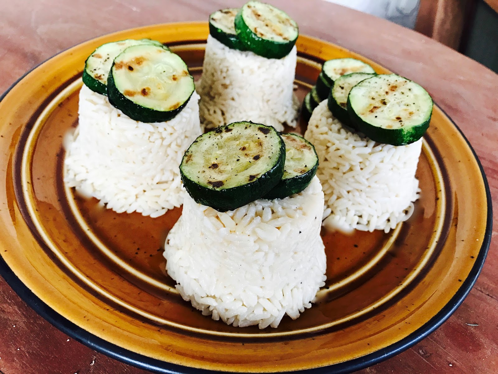 GarlicOnion Rice Timbales with Grilled Zucchini