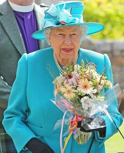 Queen Elizabeth opted for a silver and turquoise broach which she wore on the left side of her fitted blazer at Balmoral