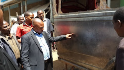 Richard Muteti CEO Jua Kali Federation inspecting Vehicle body building skills