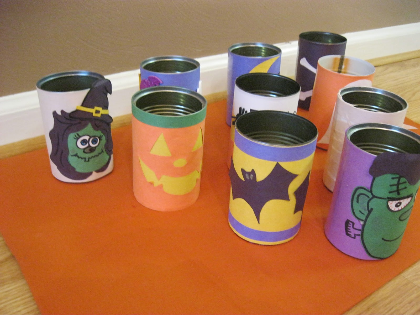 Carnival Can knock down game: Stack 6 cans in a pyramidpattern and give ...