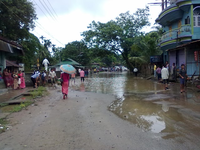 NH-53 blocked at Fulertal due to water logging in front of Block off: Man walking on the wall.