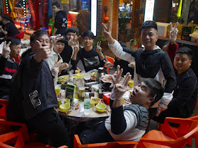 young men enjoying a late night meal outside in Changsha