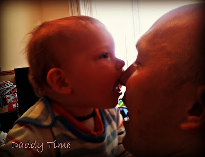 daddy and baby, baby biting nose, ready for bed