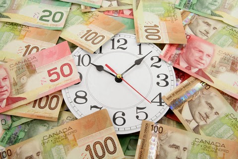 © <a href="http://www.dreamstime.com/devonyu_info#res8220357">Devonyu</a> | <a href="http://www.dreamstime.com/#res8220357">Dreamstime.com</a> - <a href="http://www.dreamstime.com/royalty-free-stock-photography-wall-clock-canadian-dollars-image2019067#res8220357">Wall Clock And Canadian Dollars Photo</a>