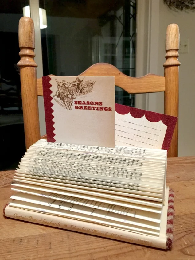 Folded book with tags and a chair
