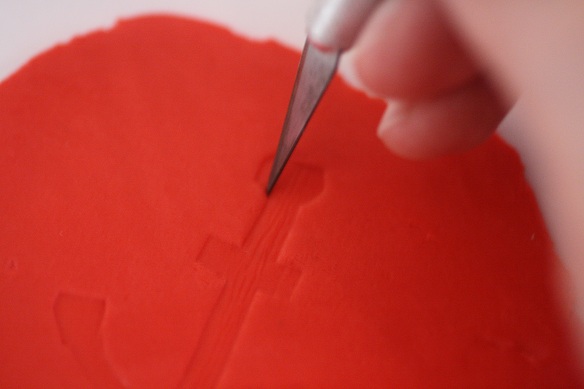 cutting out shapes out of candy clay