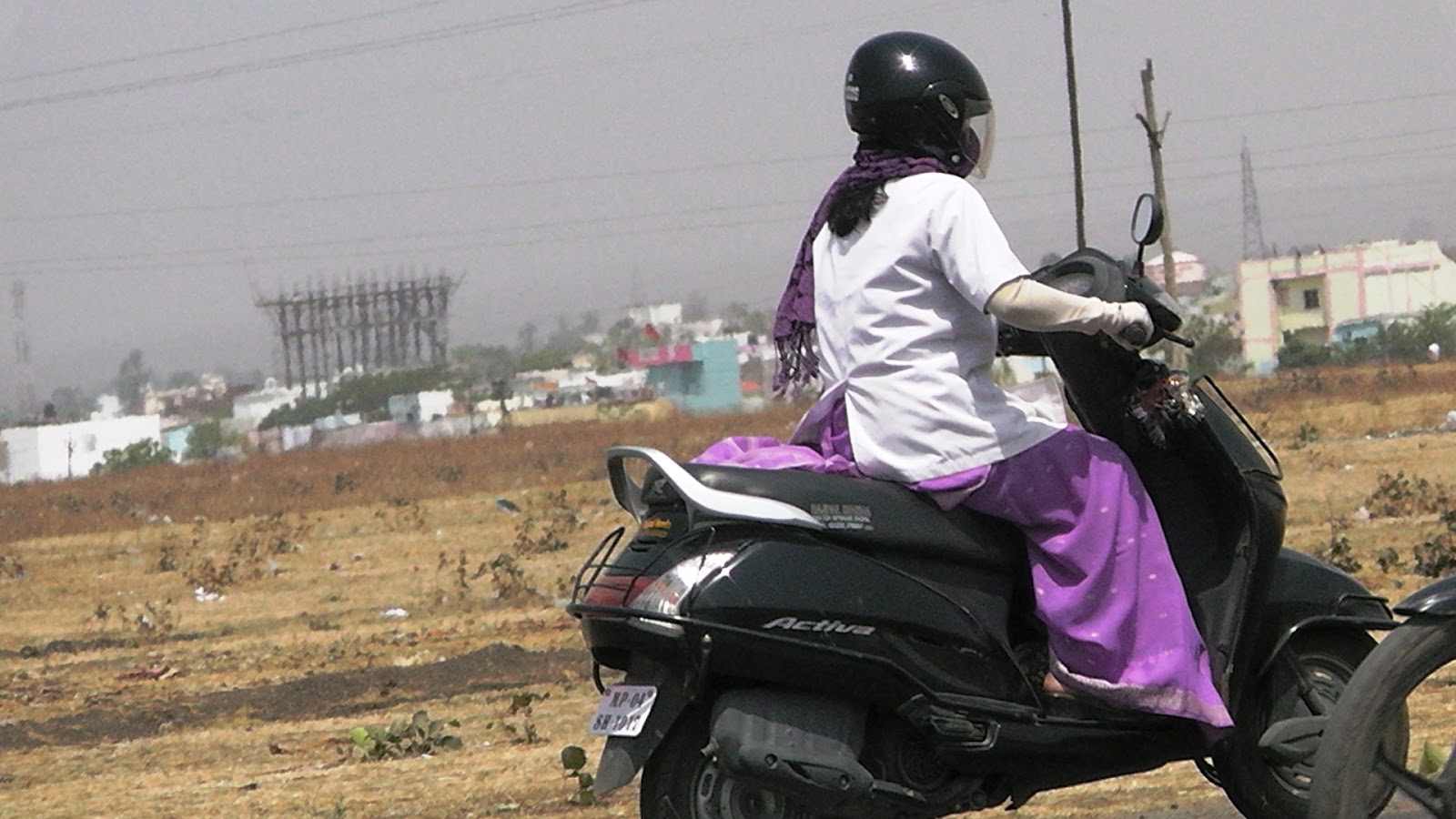 Daemon's Indian women in gloves, Indian women riding scooty