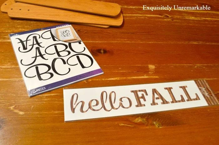 Stencil Hello fall and black letter stickers for crafts on table