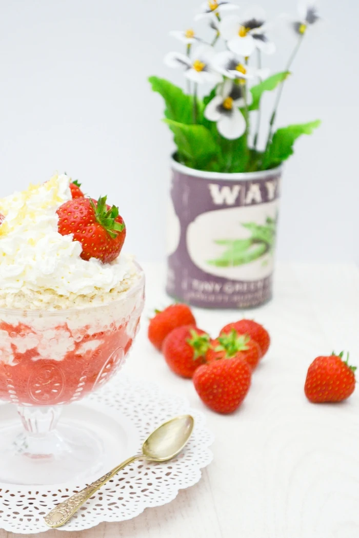 Scottish Oaty Cranachan  in a glass dessert bowl, topped with strawberries