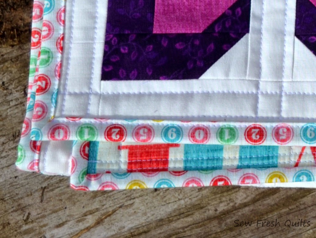 http://sewfreshquilts.blogspot.ca/2014/11/little-blooms-friday-finish.html