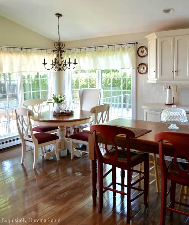 Red and White Farmhouse Kitchen  with round table and an island