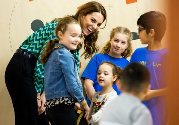 During the visit, Kate Middleton wore a new turquoise and navy print blouse by Tabitha Webb. Tabitha Webb Pansy pussybow in green chevron