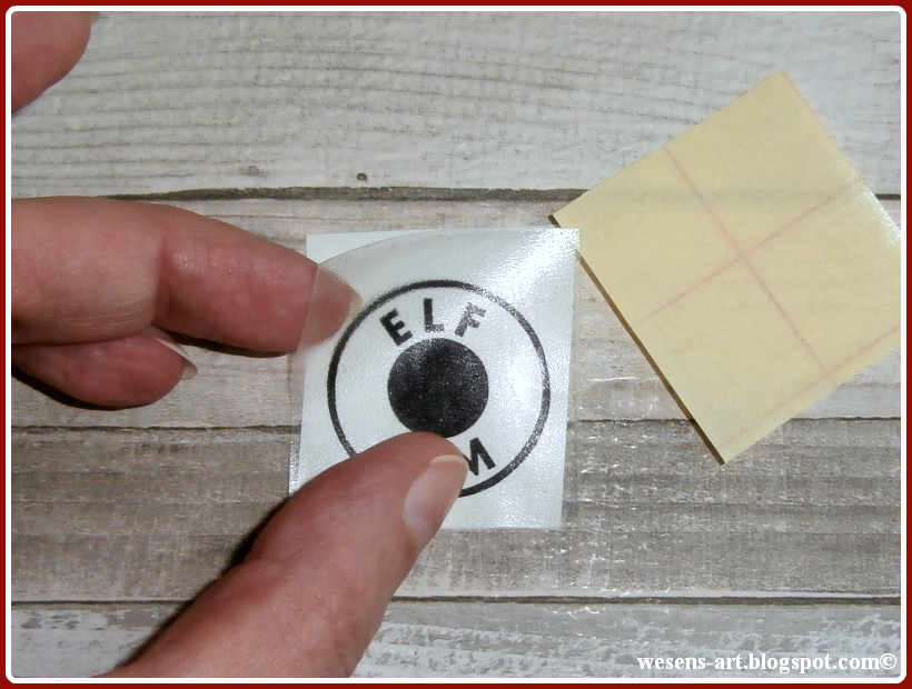 WesensArt applying vinyl onto glass globes