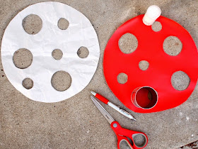 To make a DIY Ikea Hack toadstool seat, cut out a red contact paper top
