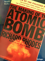 The Making of the Atomic Bomb, by Richard Rhodes, superimposed on Intermediate Physics for Medicine and Biology.